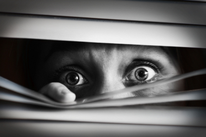 Scared-woman-peering-through-blinds-1acdf1-1.jpg